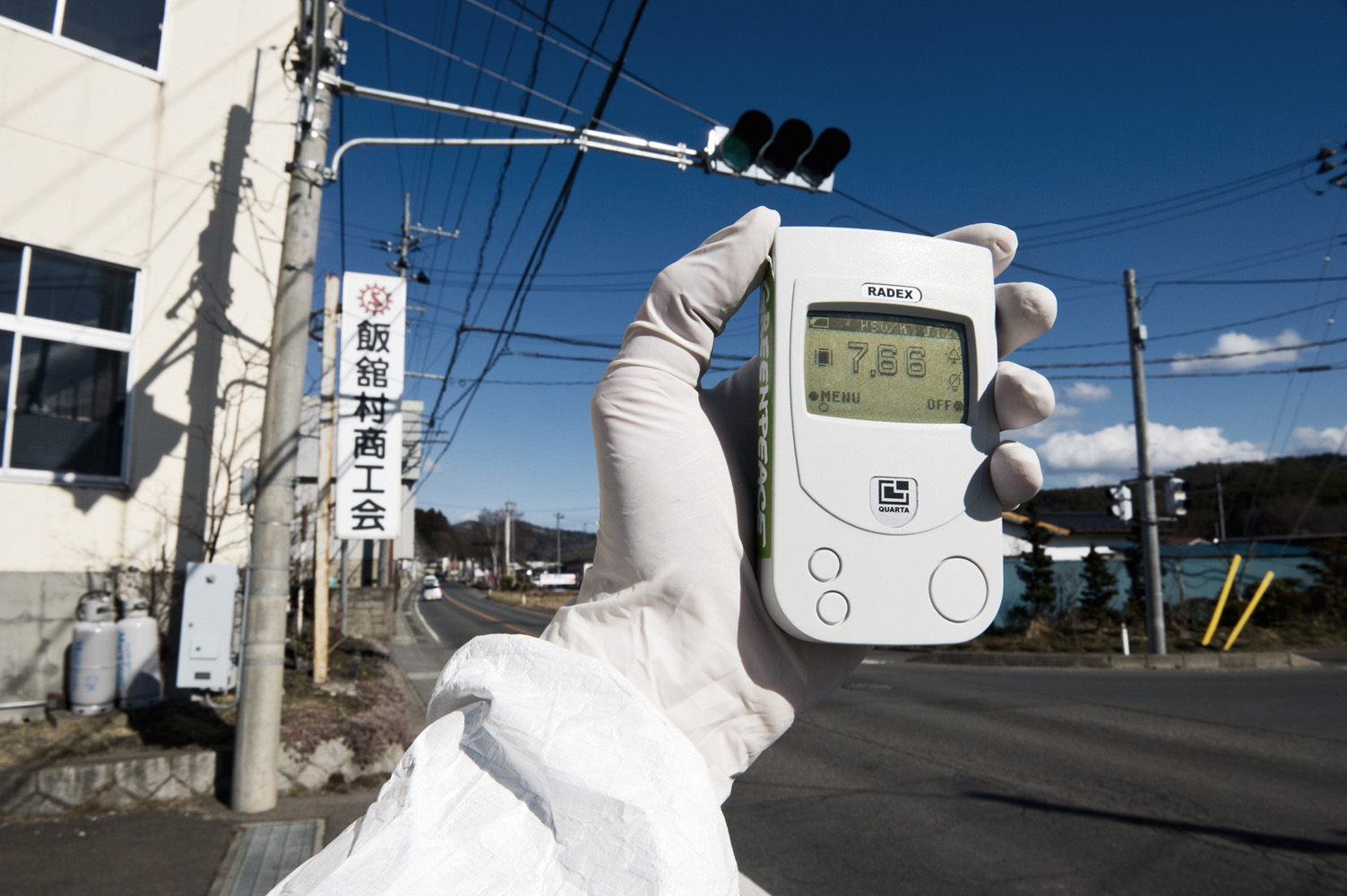 Iitate, Fukushima Prefecture  Japan, 27 March 2011 Greenpeace monitoring radiation levels far above legal limits. The geiger counter showing 7.66 micro Sievert per hour, and within 6 days people would receive a yearly dose of radioactivity. Iitate is located more then 40 km from Fukushima Nuclear Power Station and the village has still not been evacuated.